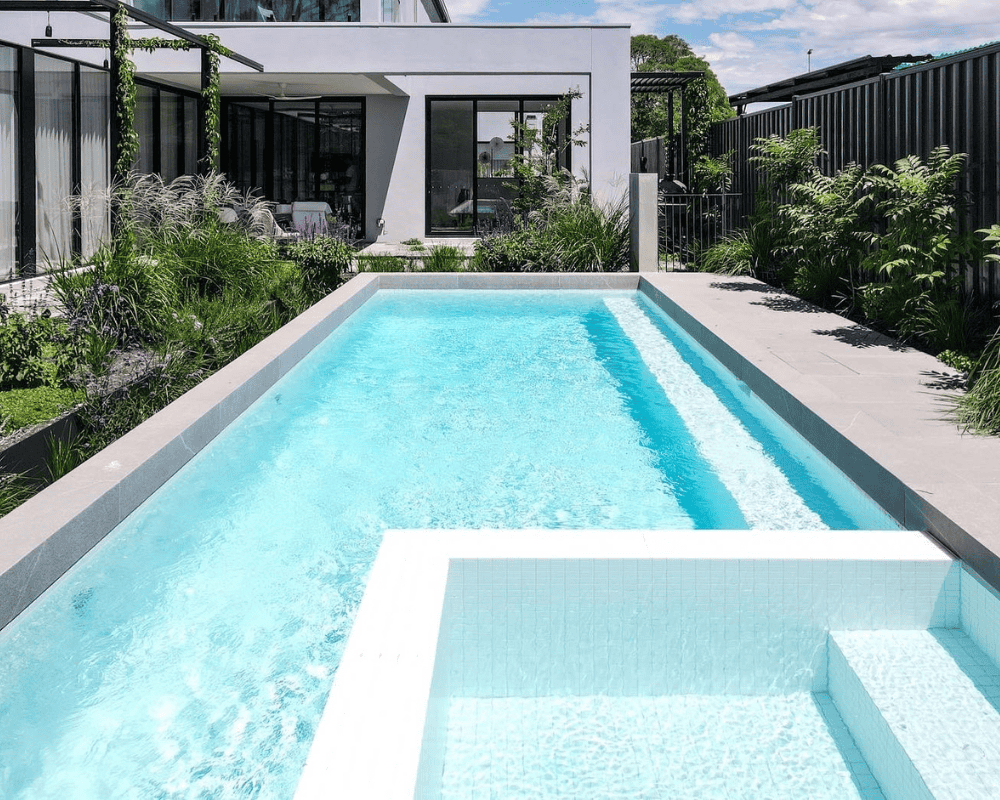 Modern backyard pool with sleek design and surrounding garden in Australia.
